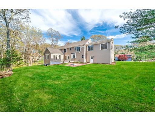 84 Forest Avenue Cohasset, MA 02025 - Photo 30 of 30 a view of a house with a big yard and large trees