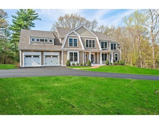 84 Forest Avenue Cohasset, MA 02025 - Photo 3 of 30 a front view of a house with a garden and swimming pool