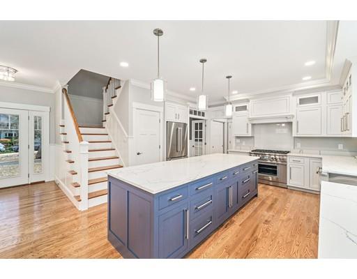 84 Forest Avenue Cohasset, MA 02025 - Photo 5 of 30 a large kitchen with cabinets wooden floor and stainless steel appliances