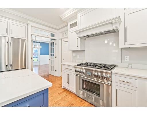 84 Forest Avenue Cohasset, MA 02025 - Photo 6 of 30 a kitchen with a stove top oven and cabinets