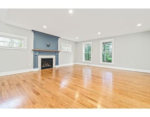 84 Forest Avenue Cohasset, MA 02025 - Photo 10 of 30 a view of empty room with wooden floor and fireplace