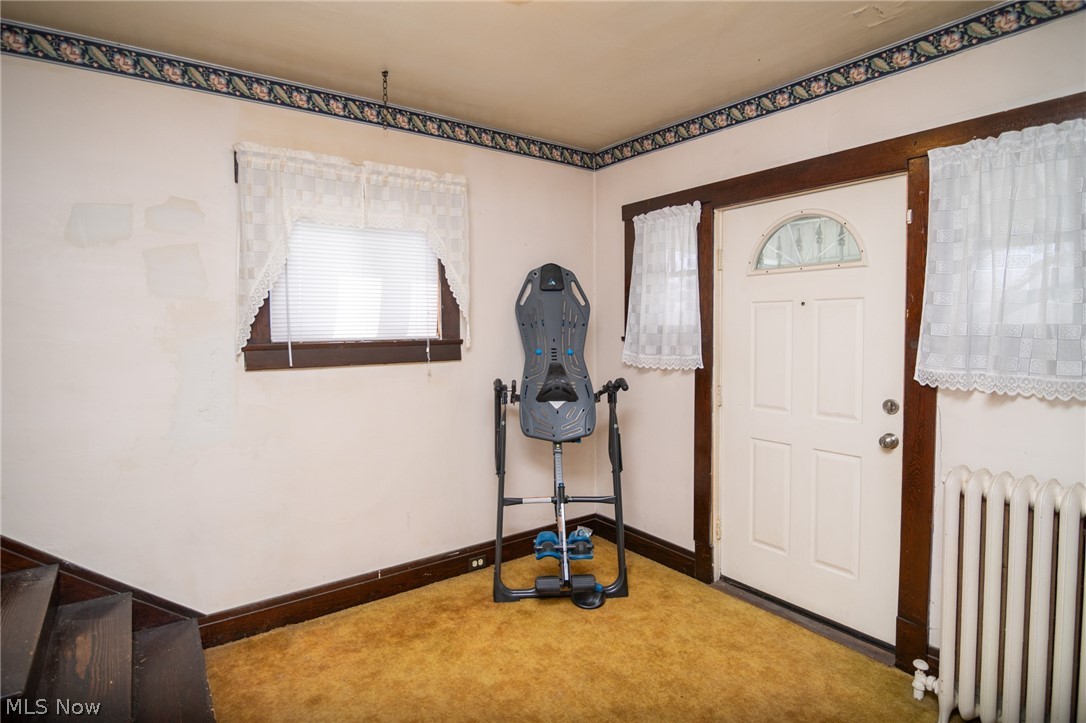 53341 Key Bellaire Road Bellaire, OH 43906 - Photo 31 of 48 Carpeted entrance foyer featuring radiator heating unit and baseboards