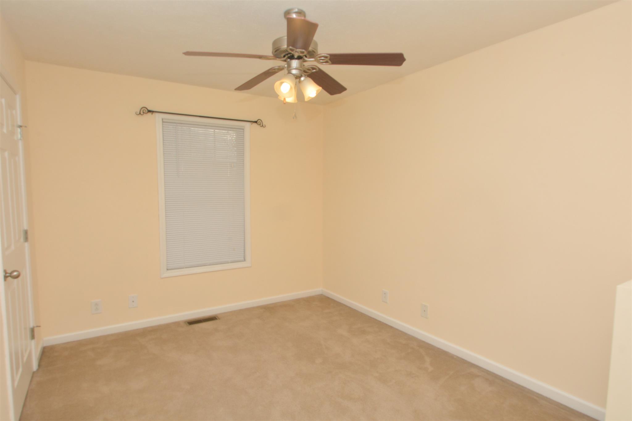 10495 Bell Station Road Oak Grove, KY 42262 - Photo 13 of 18 an empty room with a window and a fan