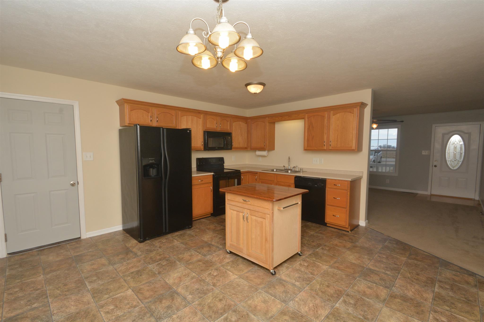 10495 Bell Station Road Oak Grove, KY 42262 - Photo 8 of 18 a kitchen with stainless steel appliances granite countertop a refrigerator a stove a sink and a microwave