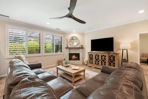a dining room with furniture and wooden floor