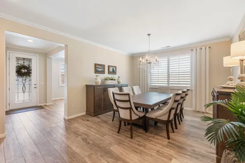 a spacious bathroom with a double vanity sink a mirror and shower