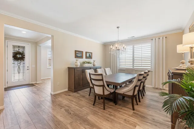 a spacious bathroom with a double vanity sink a mirror and shower