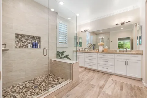 a bedroom with a bed and a television