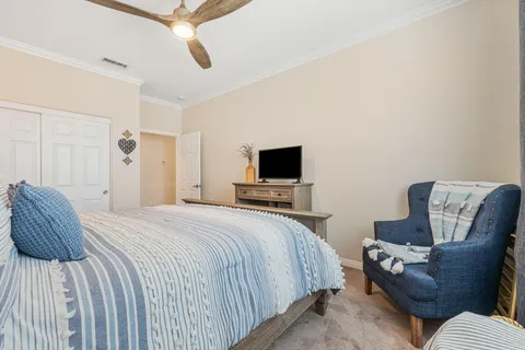 a bathroom with a sink mirror vanity and toilet