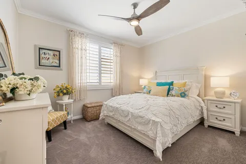 a view of a swimming pool with a table and chairs