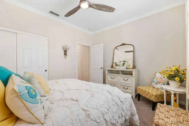 a view of a room with painted wall paintings and a wooden floor
