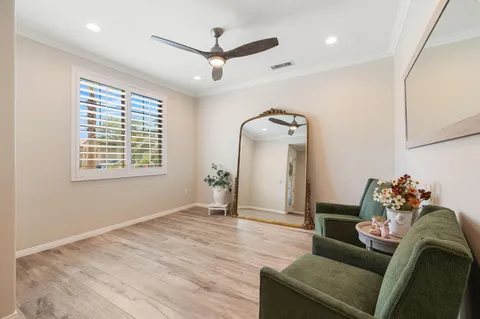 a large kitchen with a table and chairs