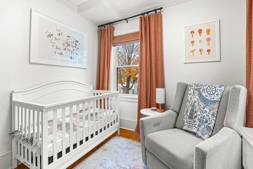 209 Washington Street, Unit 209 Winchester, MA 01890 - Photo 11 of 35 a bedroom with furniture and a large window