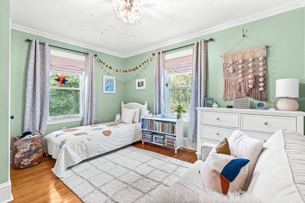 209 Washington Street, Unit 209 Winchester, MA 01890 - Photo 12 of 35 a bedroom with furniture and a large window
