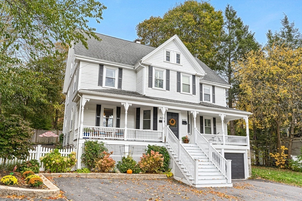 209 Washington Street, Unit 209 Winchester, MA 01890 - Photo 2 of 35 a front view of a house with a yard