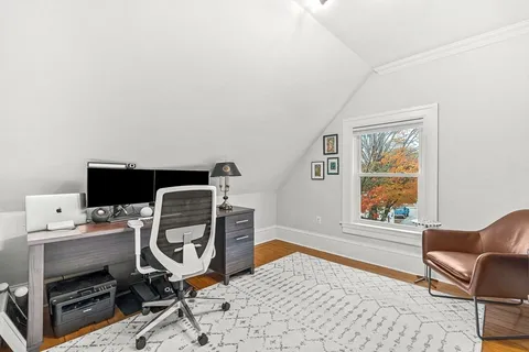 a workspace with furniture and window