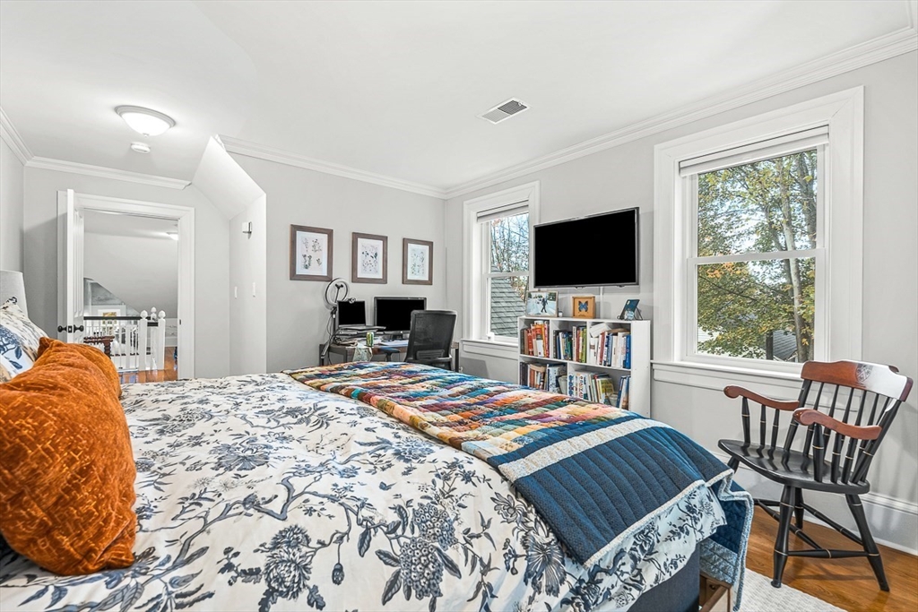 209 Washington Street, Unit 209 Winchester, MA 01890 - Photo 22 of 35 a bed room with a bed and a television