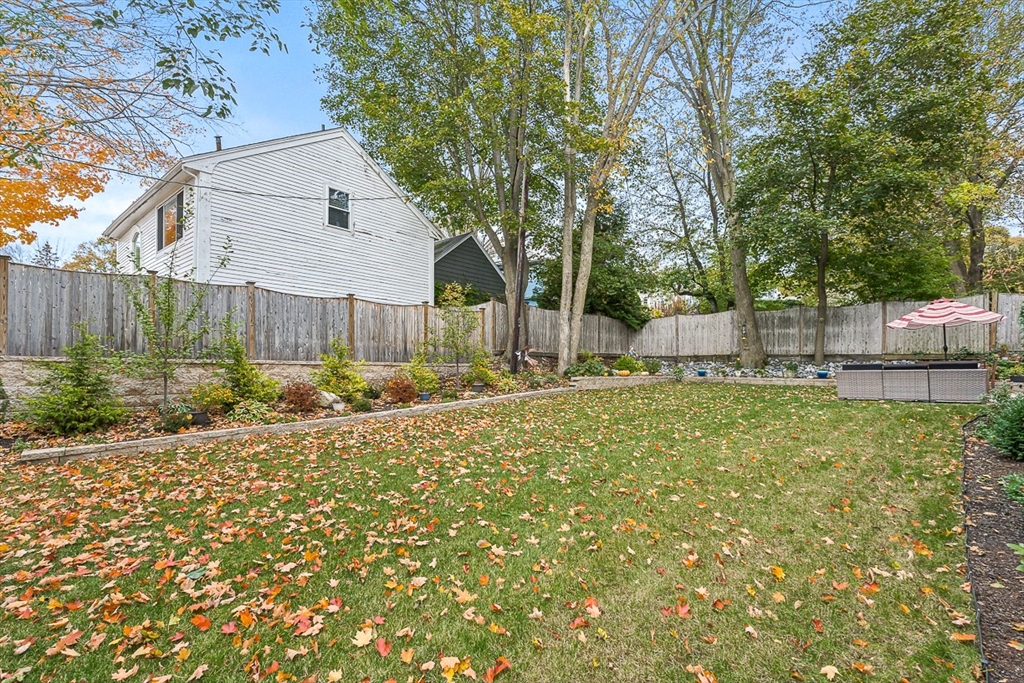 209 Washington Street, Unit 209 Winchester, MA 01890 - Photo 30 of 35 a view of backyard of the house