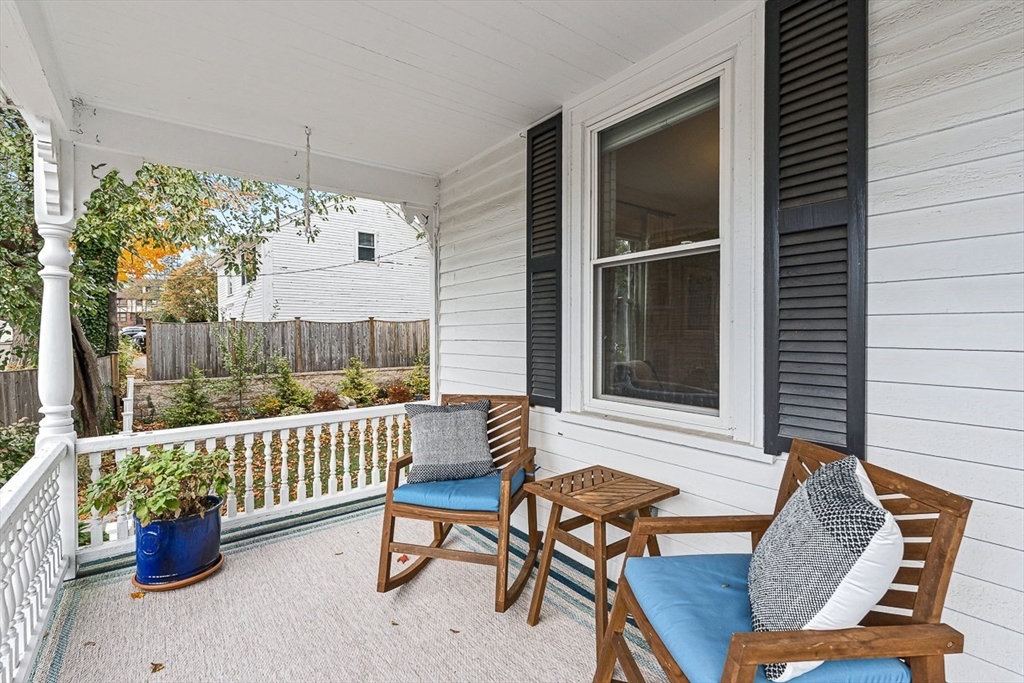 209 Washington Street, Unit 209 Winchester, MA 01890 - Photo 3 of 35 a view of a chairs and table in the balcony