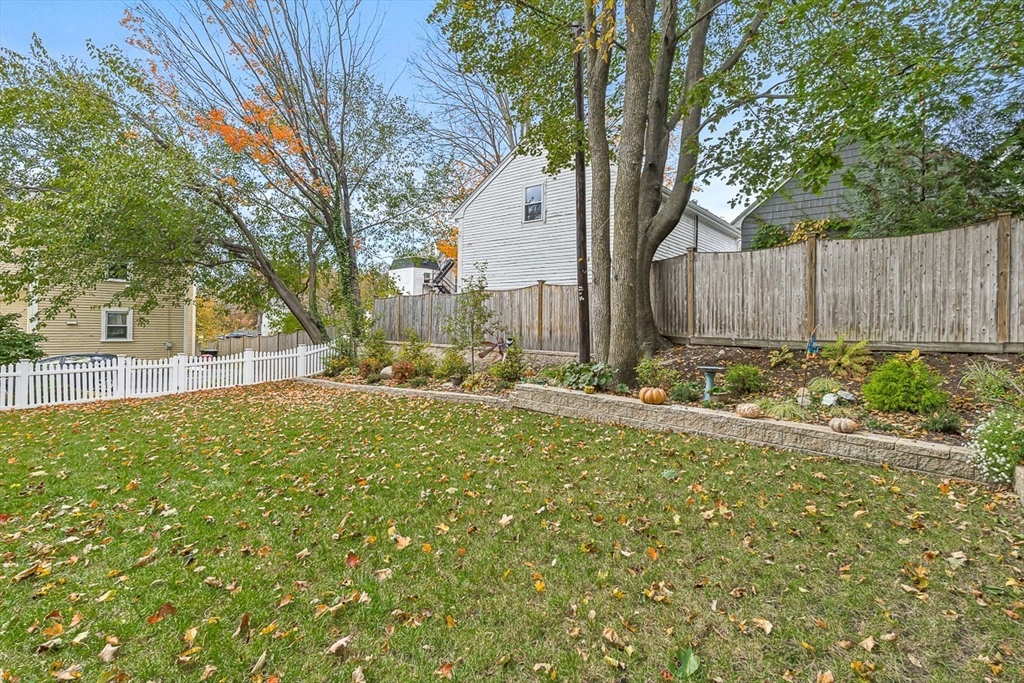 209 Washington Street, Unit 209 Winchester, MA 01890 - Photo 31 of 35 a view of backyard with tree