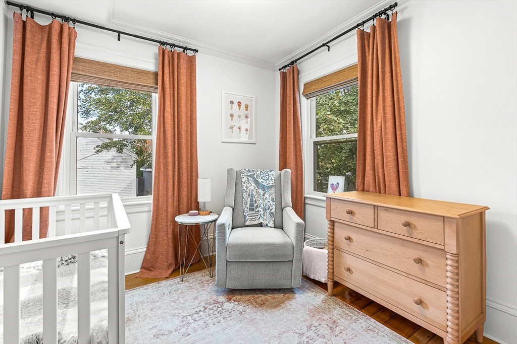 209 Washington Street, Unit 209 Winchester, MA 01890 - Photo 10 of 35 a bedroom with a bed and a window