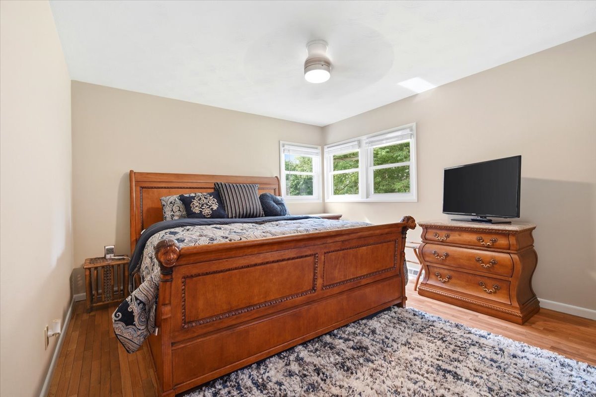 203 Highview Drive Eureka, IL 61530 - Photo 15 of 49 a bedroom with a bed and flat screen tv