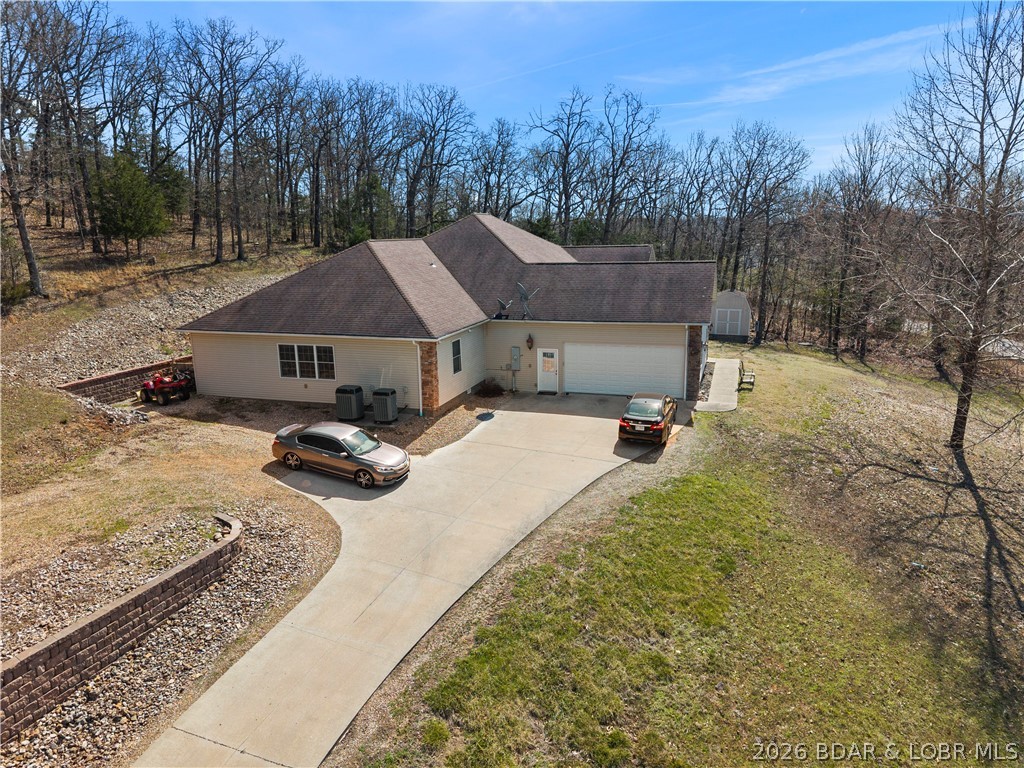 overview of garage and driveway