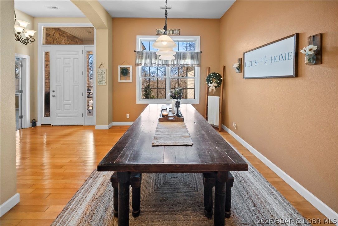 47 Mockingbird Road Lake Ozark, MO 65049 - Photo 8 of 65 common area anchored by wooden table