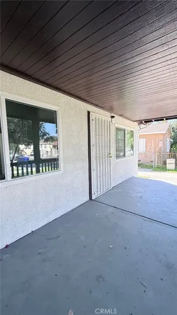 a view of empty room with floor to ceiling window