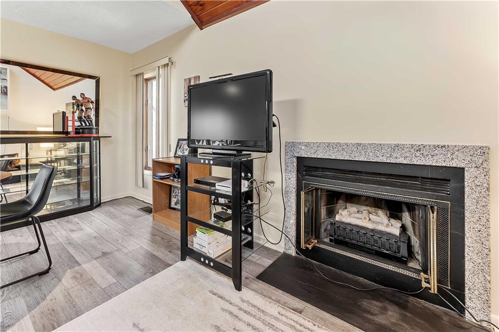 620 The Maples Farmington, PA 15437 - Photo 12 of 38 a living room with furniture a flat screen tv and a fireplace