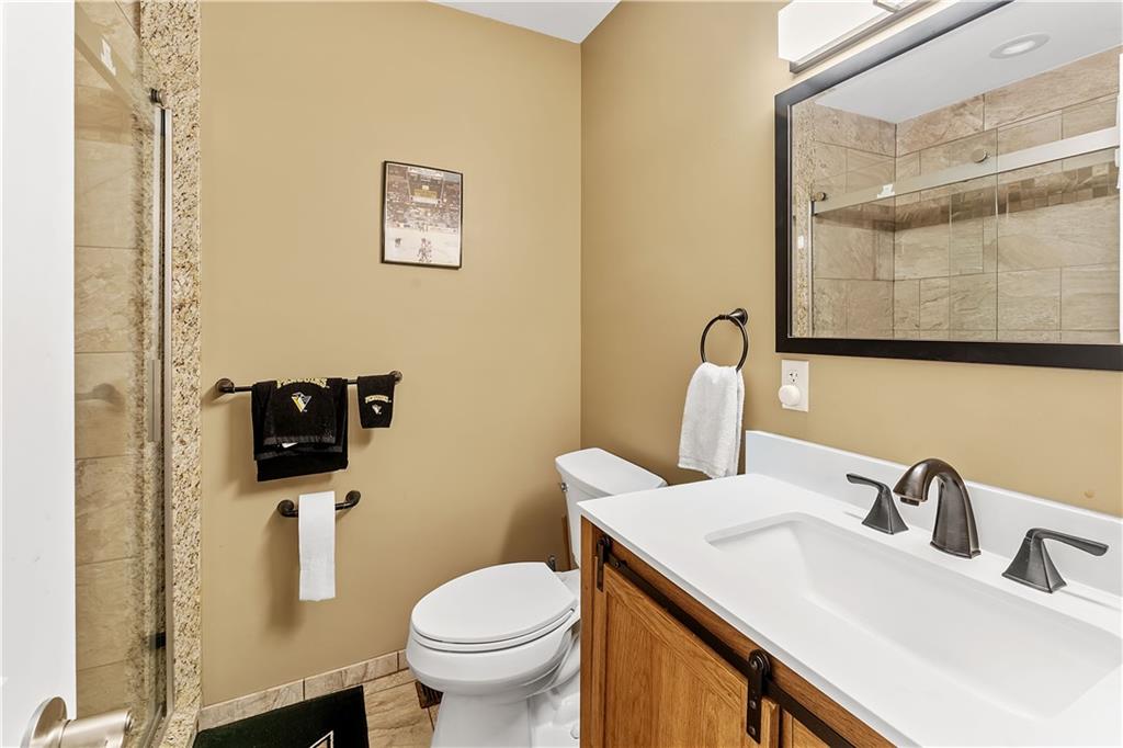 620 The Maples Farmington, PA 15437 - Photo 14 of 38 a bathroom with a toilet sink and mirror