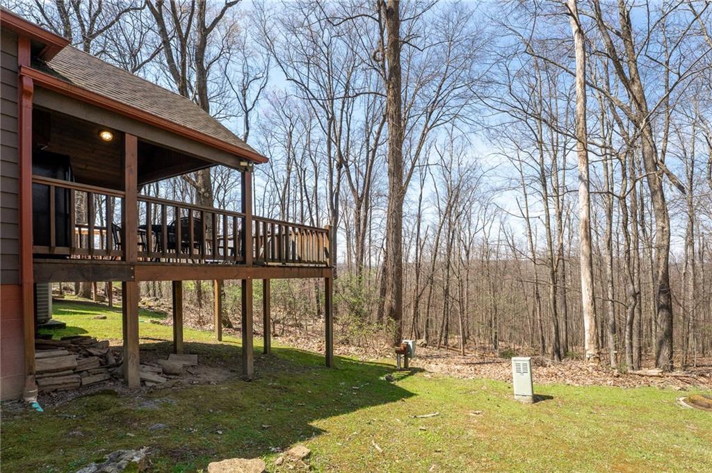 620 The Maples Farmington, PA 15437 - Photo 27 of 38 a backyard of a house with lots of green space and fountain