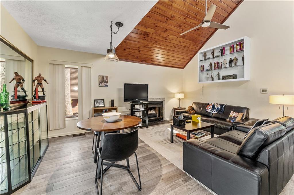 620 The Maples Farmington, PA 15437 - Photo 6 of 38 a living room with furniture kitchen view and a flat screen tv