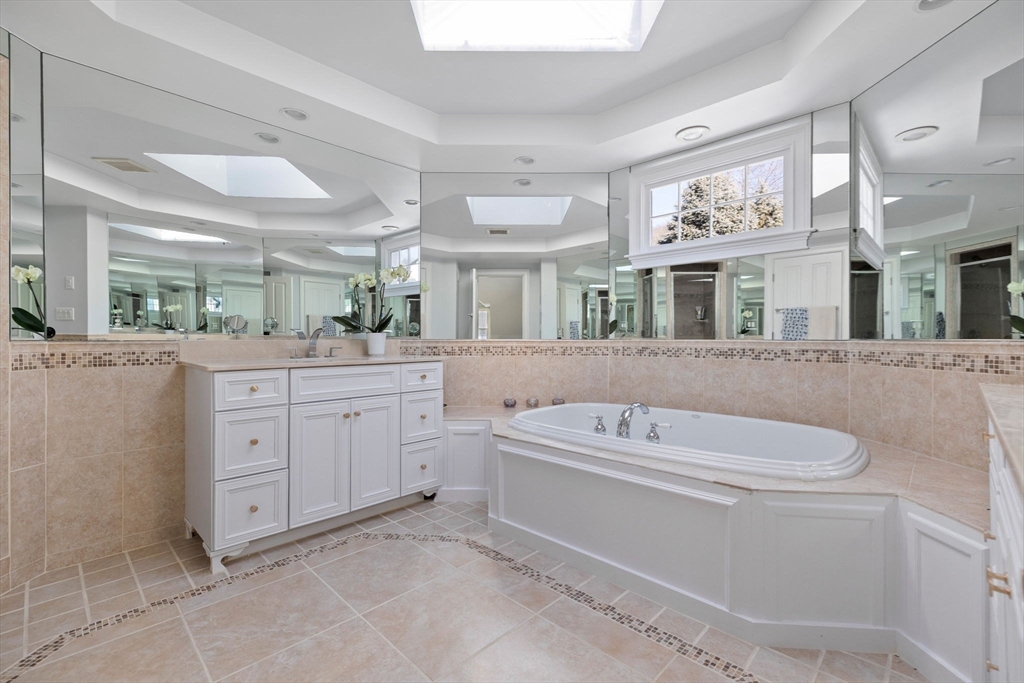 20 Risley Road Newton, MA 02465 - Photo 15 of 41 a spacious bathroom with a granite countertop sink and a mirror