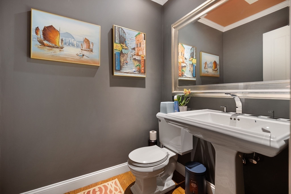 20 Risley Road Newton, MA 02465 - Photo 29 of 41 a bathroom with a toilet a sink and mirror