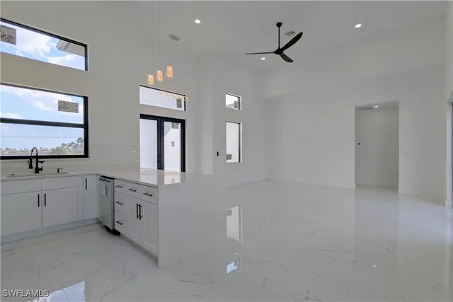 a bathroom with double vanity and a mirror
