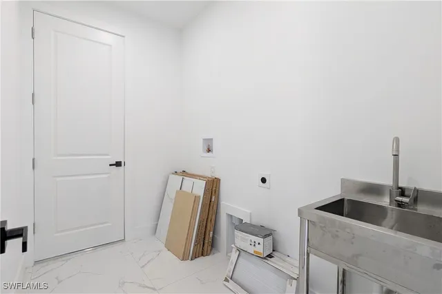 a kitchen with a sink and cabinets