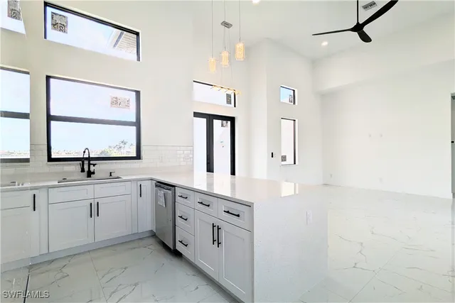 a spacious bathroom with a double vanity sink a large mirror and a bathtub