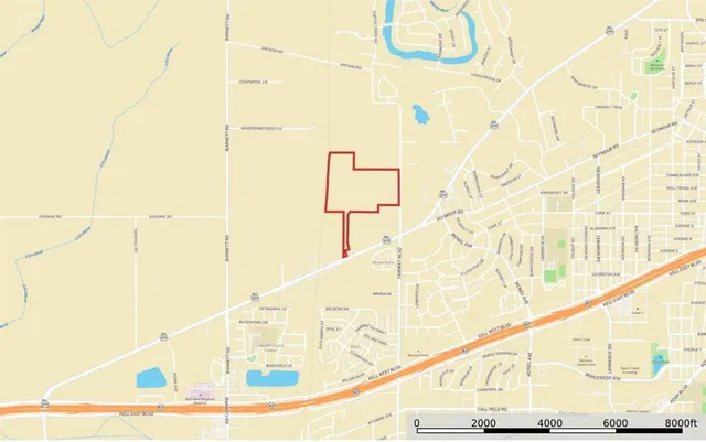 a view of a lake with lawn chairs