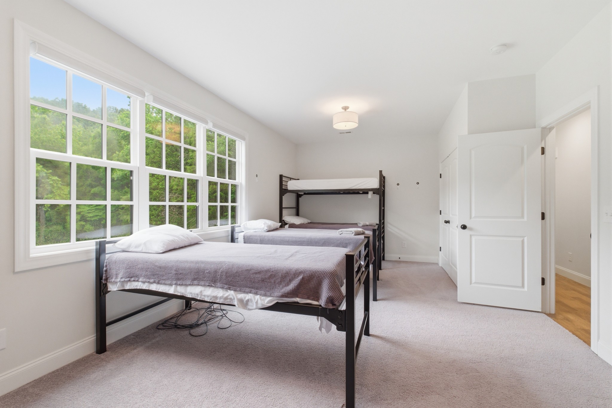 7075 Pinewood Road Nunnelly, TN 37137 - Photo 31 of 49 a bed sitting in a spacious bedroom next to a window