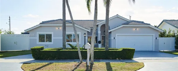a front view of a house with garage