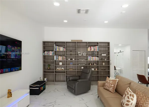 a living room with a couch and a flat screen tv