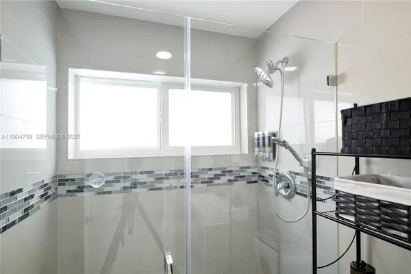 a bathroom with a sink a washer and dryer