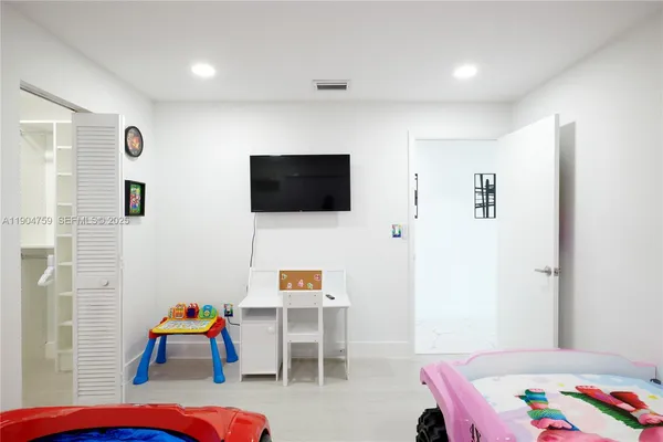 a view of a house with swimming pool and furniture
