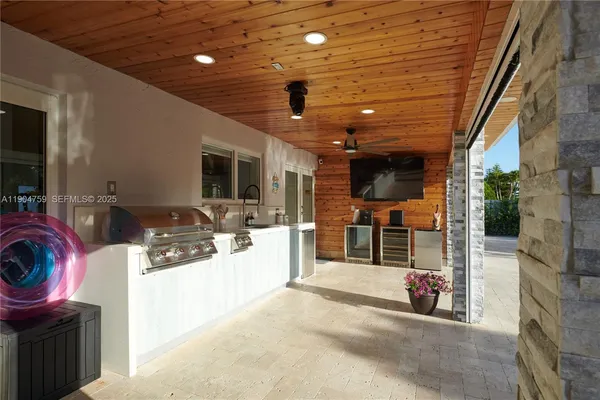 a view of a chair and table in the patio