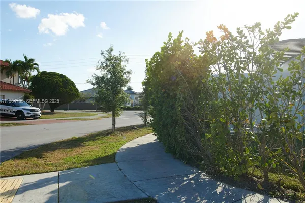 a view of a yard with swimming pool