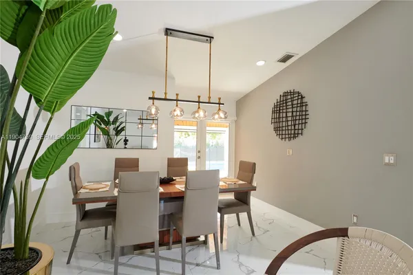 a view of a dining room with furniture window and outside view