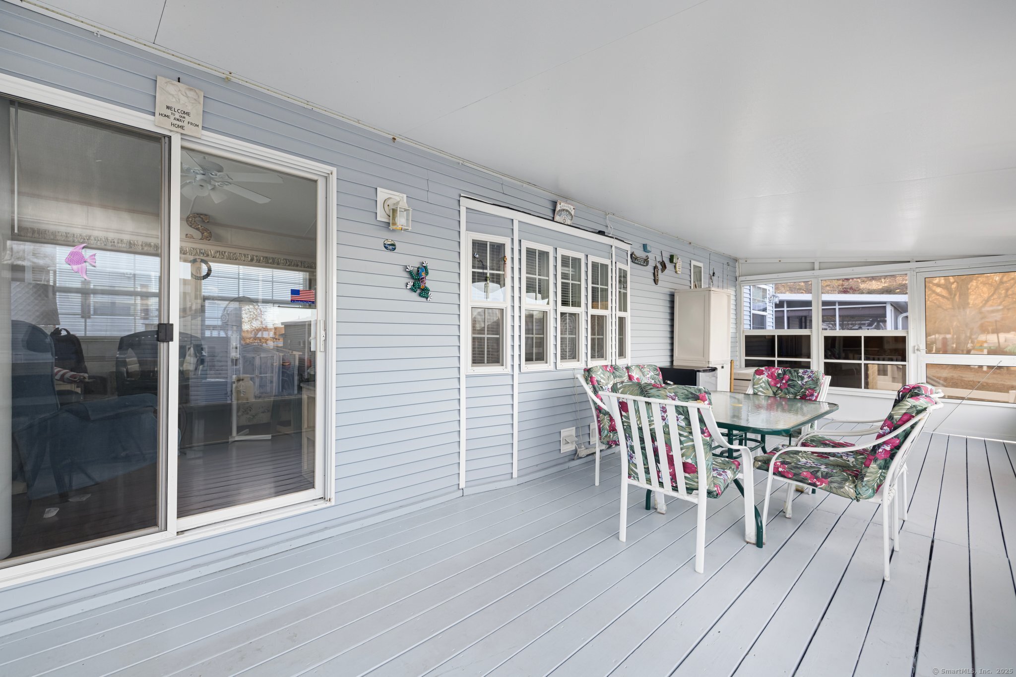 262 Shetucket Turnpike, Unit 69 Griswold, CT 06351 - Photo 11 of 37 a dining room with furniture and wooden floor