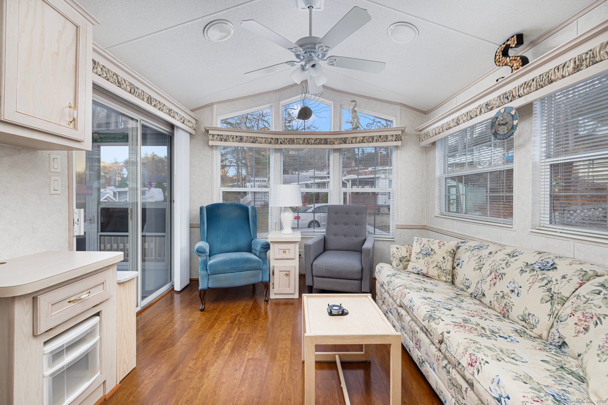 262 Shetucket Turnpike, Unit 69 Griswold, CT 06351 - Photo 17 of 37 a living room with furniture and a large window