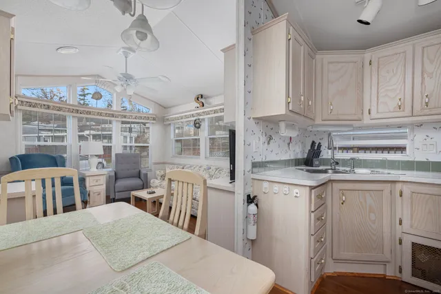 a kitchen with stainless steel appliances granite countertop a sink and cabinets